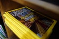 National Geographic magazines pile on a wooden shelf