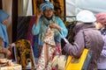 Yogyakarta, Indonesia - August 02, 2019: Woman selling various batik cloth, textyle. Traditional colorful indonesian