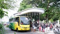 Yogyakarta-Indonesia, 27 December 2022: Passengers line up to board the bus at the Yogyakarta Malioboro bus stop