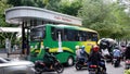 Yogyakarta-Indonesia, 27 December 2022: Passengers line up to board the bus at the Yogyakarta Malioboro bus stop