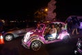 Yogyakarta, Indonesia - December 31, 2018: People ride neon cars