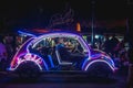 Yogyakarta, Indonesia - December 31, 2018: People ride neon cars