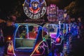 Yogyakarta, Indonesia - December 31, 2018: People ride neon cars