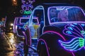 Yogyakarta, Indonesia - December 31, 2018: People ride neon cars