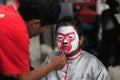 Young participants are making preparations by decorating their faces for the carnival of Yogyakarta XI Chinese Culture Week