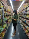 Yogyakarta, Indonesia - February 2023: Asian woman shopping in the retail shop
