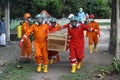 Yogyakarta, Indonesia - July 21, 2021 : Some people in safety suits and gas masks were carrying coffins of covid-19 victim at day