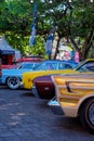 A lineup of classic American cars on Hotrodiningrat parking lot