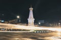 Yogyakarta, Indonesia - November, 2019: Tugu Jogja or Yogyakarta Monument, Indonesia. Taken in night with vehicle traffic light.