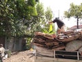 Yogyakarta, Indonesia November-22-2020: workers in landfills carrying paper waste