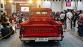 Modified classic orange Chevrolet 3100 Task Force truck