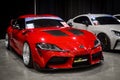 Modified red Toyota GR Supra MK V A91 in Black Auto Battle