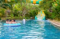 Yogyakarta, Java, Indonesia - 12 June 2019: Young people enjoying themselves on a slide at a waterpark