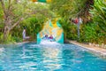 Yogyakarta, Java, Indonesia - 12 June 2019: Young people enjoying themselves on a slide at a waterpark