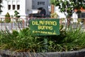 `Dilarang buang sampah disini` is warning board in Indonesian which means do not throw any trash here.