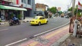 Yogyakarta September 25 2021 a yellow Volkswagen Beetle on the road Royalty Free Stock Photo