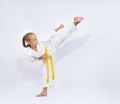 Yoko geri kick in the performance of small sportswoman Royalty Free Stock Photo
