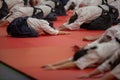 Namur, Belgium - March 29, 2025 : aikido stretching exercises before practice. Yoko Okamoto International Seminar. Royalty Free Stock Photo