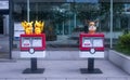 Mailboxes of the Japanese Post with statues of the characters Pikachu and Eevee from Pokemon