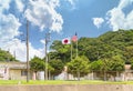 National flags of Japan and United States of America on the Azuma Island in the Yokosuka Naval Port.