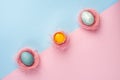 Yolk of broken egg in eggshell and two blue eggs decorated with Royalty Free Stock Photo