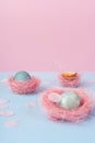 Yolk of broken egg in eggshell and two blue eggs decorated with Royalty Free Stock Photo