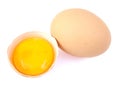 Yolk and broken egg on white background. Royalty Free Stock Photo