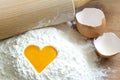 Yolk egg in flour love baking concept