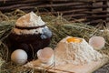Yolk in flour. Broken egg. White egg. Flour in a clay pot. Royalty Free Stock Photo