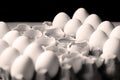 Yolk among many white eggs Royalty Free Stock Photo