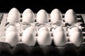 Yolk among many white eggs Royalty Free Stock Photo
