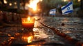 Yom HaZikaron theme, a single candle lit in a small glass, placed on a stone surface with the backdrop of a waving