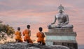 Yong buddhist monk fire candles to the Buddha