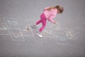 Yong little girl on the hopscotch Royalty Free Stock Photo