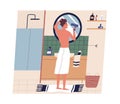 Yong man drying hair with hairdryer in bathroom. Guy standing with bath towel on hips and looking at mirror while using Royalty Free Stock Photo