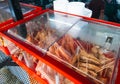 Yong Tau Fu on stick inside a display container. Delicious Asian Chinese cuisine of fish, crab, egg and paste stuffed Royalty Free Stock Photo