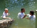 YORDANIT, ISRAEL. Pilgrims make ablution in holy waters of the Jordan River