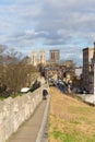 York City Walls in historic Yorkshire city England, a famous walk for tourists with view towards York Minster