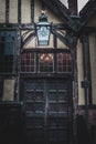 YORK, ENGLAND, DECEMBER 12, 2018: Yorkshire`s Merchant Adventurers Hall wooden doorstep and old lantern with its logo