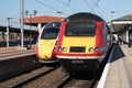 Class 43 LNER train on a platform next to modern Azuma train Royalty Free Stock Photo
