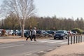 Couple walking across a pedestrian zebra crossing