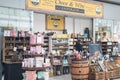 Exterior of Cheese and Wine Emporium store shop showing company logo, sign, signage and branding. Inside shopping centre mall