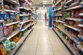 Grocery store aisle showing crips, biscuits and snacks.