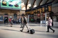 Interior of Railway station showing passengers and Train Information Display board on concourse Royalty Free Stock Photo