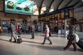 Interior of Railway station showing passengers and Train Information Display board on concourse Royalty Free Stock Photo