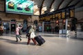 Interior of Railway station showing passengers and Train Information Display board on concourse Royalty Free Stock Photo