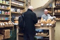 Male customer paying for goods inside a bakery shop store