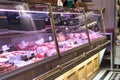 Shop display of meat in a traditional chiller