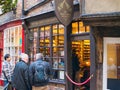 York, UK - Nov 21 2023: Tourists outside the retail premises of The York Ghost Merchants, a popular tourist attraction