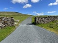 Moor top road, with dry stone walls near, Halton Gill, Yorkshire, UK Royalty Free Stock Photo